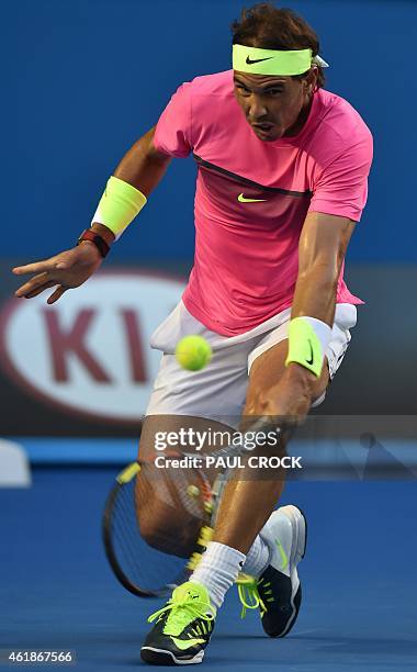 Spain's Rafael Nadal plays a shot during his men's singles match against Tim Smyczek of the US on day three of the 2015 Australian Open tennis...