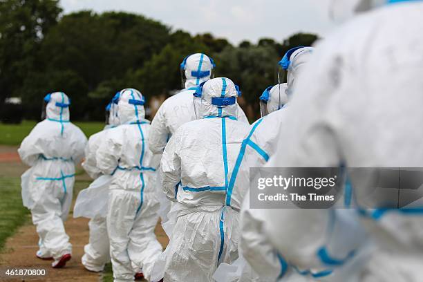 Healthcare professionals who have been recruited to work in Sierra Leone as part of the Ebola Emergency Response initiative take part in a practice...