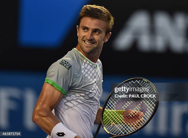 Tim Smyczek of the US reacts during his men's singles match against Spain's Rafael Nadal on day three of the 2015 Australian Open tennis tournament...