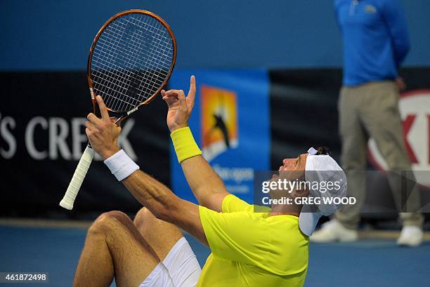 Tunisia's Malek Jaziri celebrates after victory in his men's singles match against France's Edouard Roger-Vasselin on day three of the 2015...