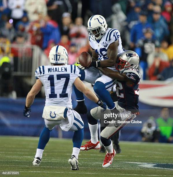 The Indianapolis Colts' Da'Rick Rogers is tackled by the New England Patriots' Devin McCourty for an incomplete pass during the first quarter as the...