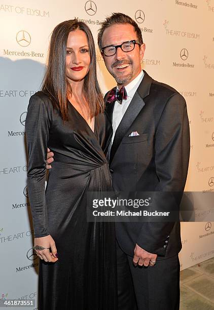 Actors Christina McLarty and David Arquette attend The Art of Elysium's 7th Annual HEAVEN Gala presented by Mercedes-Benz at Skirball Cultural Center...