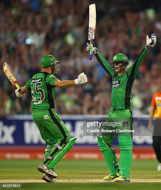 Peter Handscomb of the Melbourne Stars celebrates with team mate Scott Boland, after scoring the winning runs and a century during the Big Bash...