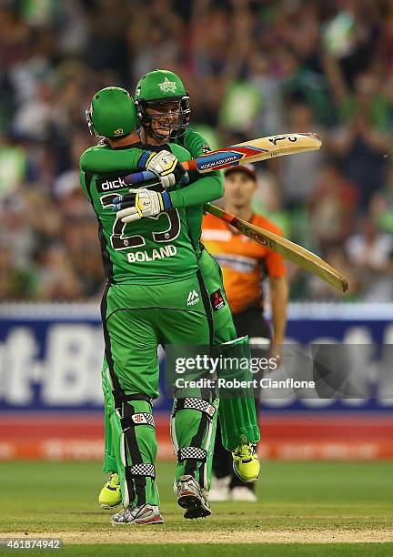 Peter Handscomb of the Melbourne Stars celebrates with team mate Scott Boland, after scoring the winning runs and a century during the Big Bash...