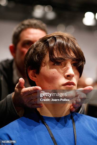 Model seen backstage ahead of the William Fan show during the Mercedes-Benz Fashion Week Berlin Autumn/Winter 2015/16 at Brandenburg Gate on January...