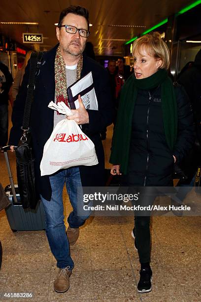 Ian Puleston-Davies and Sally Dynevor seen arriving at Euston Station ahead of the National Television Awards on January 21, 2015 in London, England.