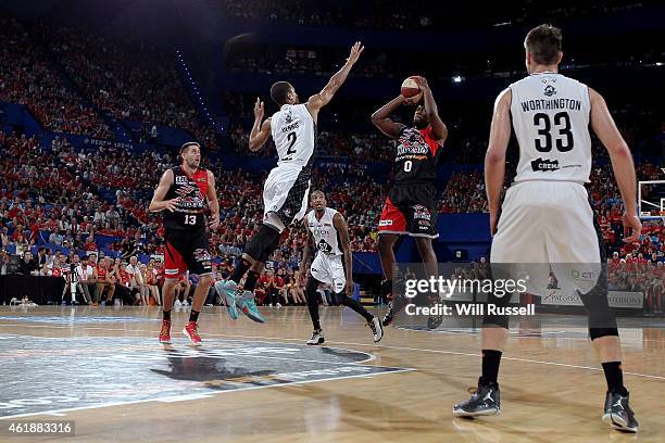 Stephen Dennis of United tries to block Jermaine Beal of the Wildcats during the round 15 NBL match between the Perth Wildcats and Melbourne United...