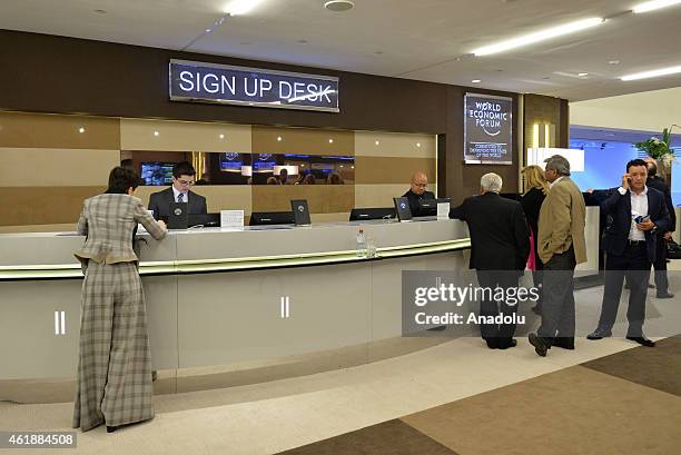 People walk in Congress Center on the opening day of the 45th Annual Meeting of the World Economic Forum , in Davos, Switzerland on January 21, 2015....