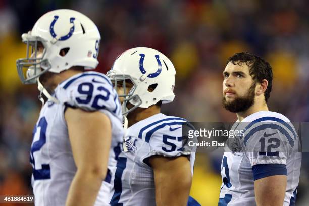 Andrew Luck of the Indianapolis Colts looks on from the sidelines against the New England Patriots during the AFC Divisional Playoff game at Gillette...