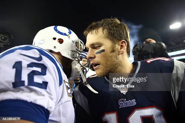 Tom Brady of the New England Patriots shakes hands with Andrew Luck of the Indianapolis Colts after their AFC Divisional Playoff game at Gillette...