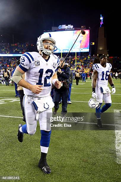 Andrew Luck of the Indianapolis Colts runs off the field being defeated by the New England Patriots in their AFC Divisional Playoff game at Gillette...