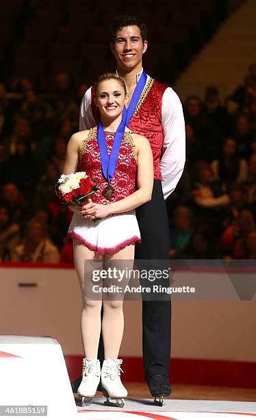 Paige Lawrence and Rudi Swiegers stand on the podium with their Senior Pair's bronze medals during the awards ceremony of the 2014 Canadian Tire...