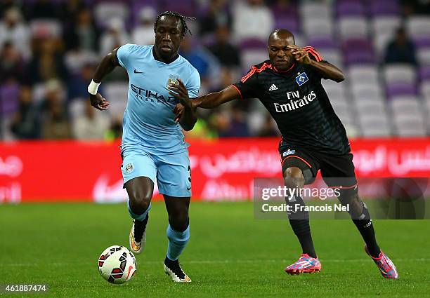 Bacary Sagna of Manchester City controls the ball against Innocent Emeghara of Hamburg during the friendly match between Hamburg SV and Manchester...