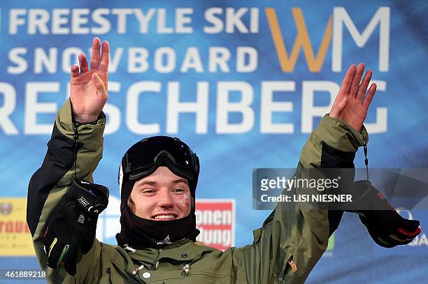 First placed Switzerland's Fabian Boesch celebrates on the podium after the Men's Ski Slopestyle Finals of FIS Freestyle and Snowboarding World Ski...