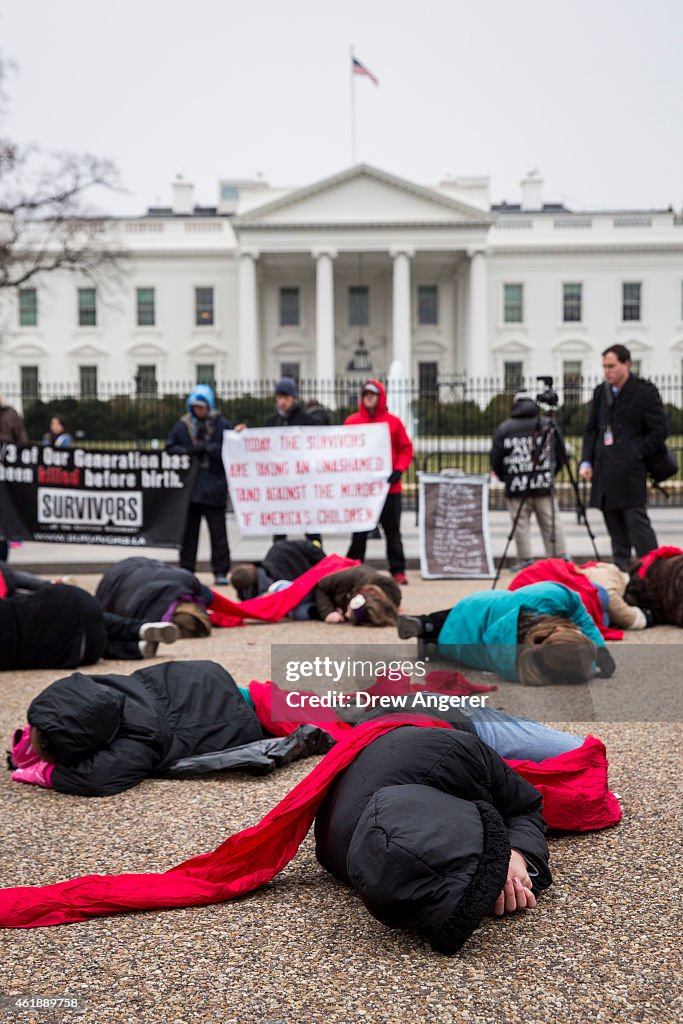 Anti-Abortion Advocates Stage "Die-In" Protest Across From White House