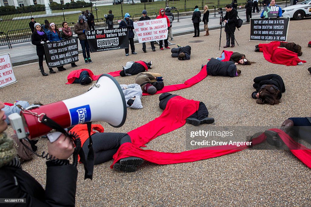 Anti-Abortion Advocates Stage "Die-In" Protest Across From White House