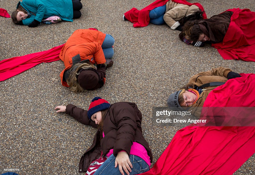 Anti-Abortion Advocates Stage "Die-In" Protest Across From White House