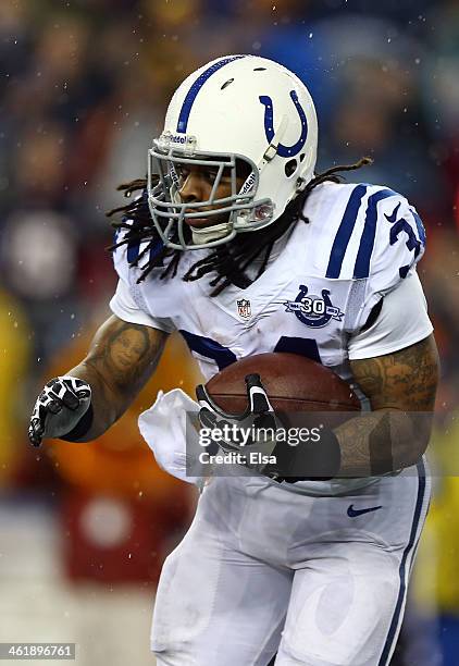 Trent Richardson of the Indianapolis Colts runs the ball against the New England Patriots during the AFC Divisional Playoff game at Gillette Stadium...