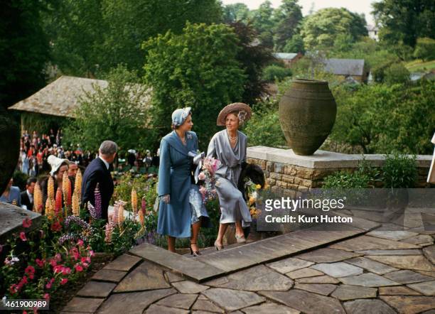 Politician and tennis player Lady Domini Crosfield goes into tea with her guest, Princess Elizabeth , during one of the annual tennis parties given...