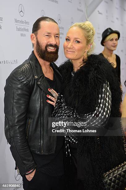 Dirk Budach and Janine Kunze attend the Guido Maria Kretschmer show during the Mercedes-Benz Fashion Week Berlin Autumn/Winter 2015/16 at Brandenburg...