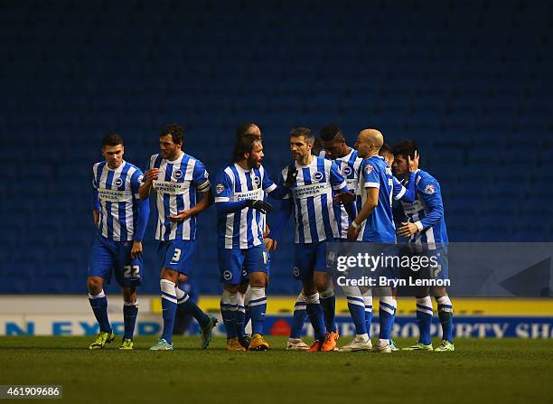 Goal scorer Joao Carlos Teixeira of Brighton and Hove Albion celebrates with team mates during the Sky Bet Championship match between Brighton & Hove...