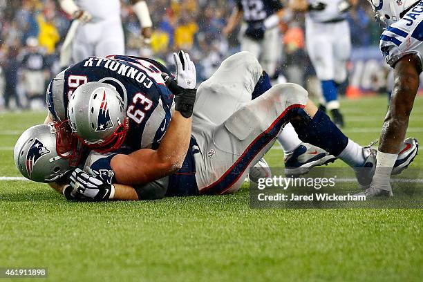 Nate Solder of the New England Patriots celebrates his third quarter touchdown with Sebastian Vollmer and Dan Connolly against the Indianapolis Colts...