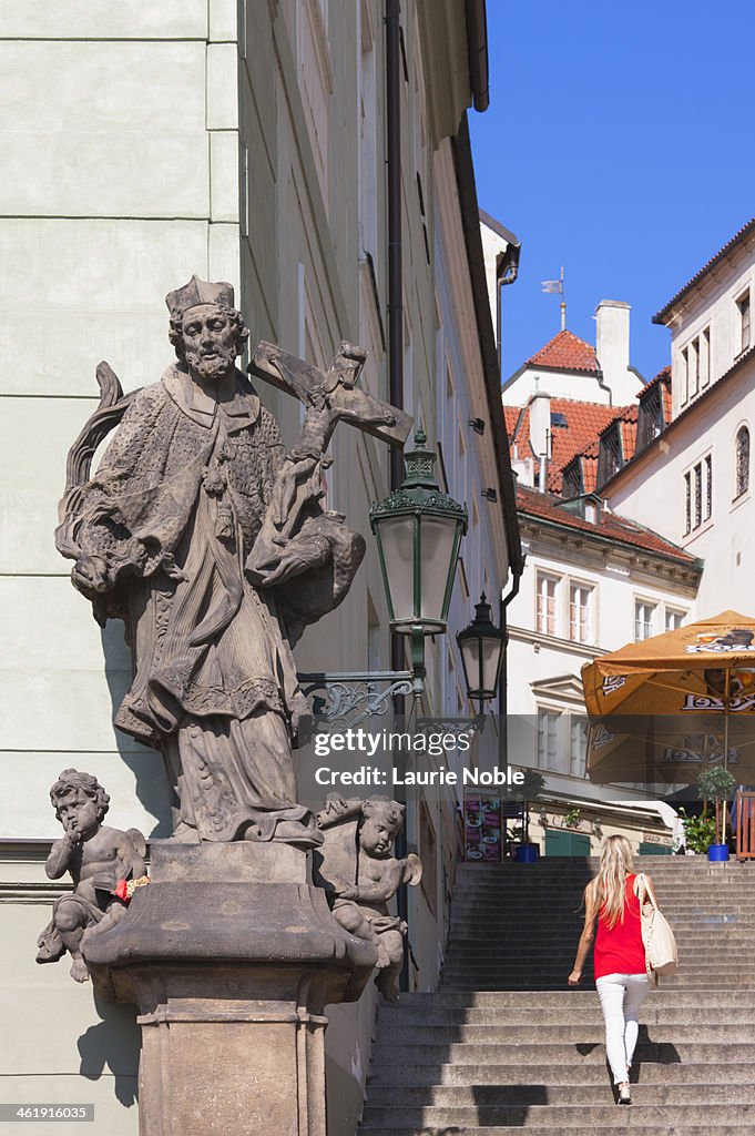 Girl walking up stairs Hradcany, Prague