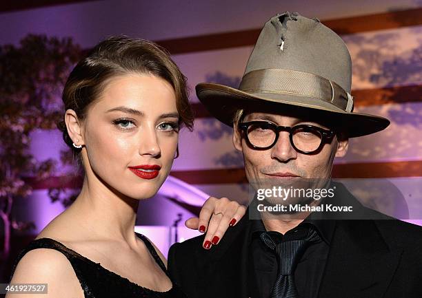 Actors Amber Heard and Johnny Depp attend The Art of Elysium's 7th Annual HEAVEN Gala presented by Mercedes-Benz at Skirball Cultural Center on...