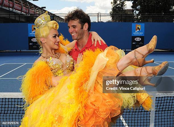 Sophia Katos from Strictly Ballroom the musical shows Malek Jaziri of Tunisia some dancing moves during the 2015 Australian Open at Melbourne Park on...