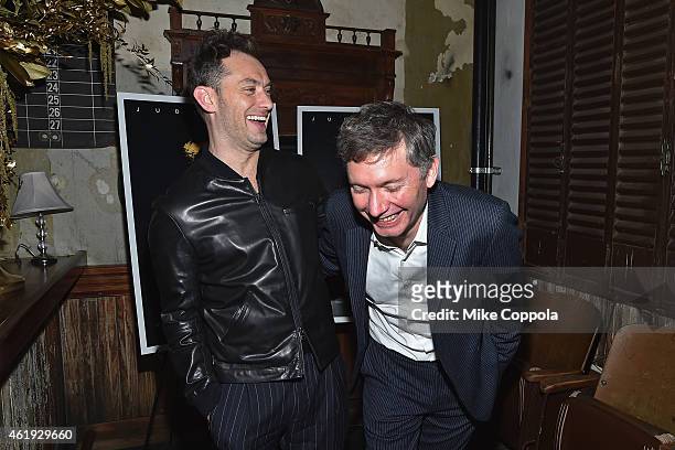 Actor Jude Law and Director Kevin Macdonald attend the "Black Sea" New York Screening after Party at Macao on January 21, 2015 in New York City.