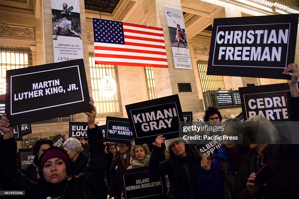Protesters holds placards with the names of the victims from...
