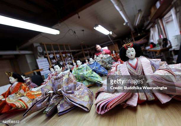 Japanese craftsman Takeshi Itou makes dolls ahead of Hinamatsuri at Kishimoto Ningyou doll workshop on January 22, 2015 in Ono, Japan. Hinamatsuri,...