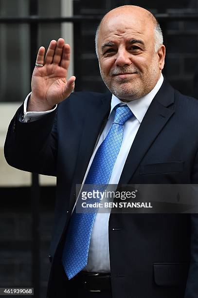 Iraqi Prime Minister Haider al-Abadi waves as he leaves following a morning meeting with British Prime Minister David Cameron in Downing Street in...