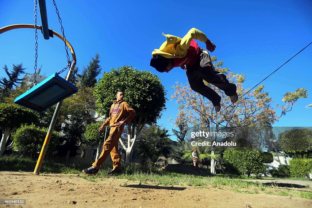 Palestinian youth practice their parkour skills