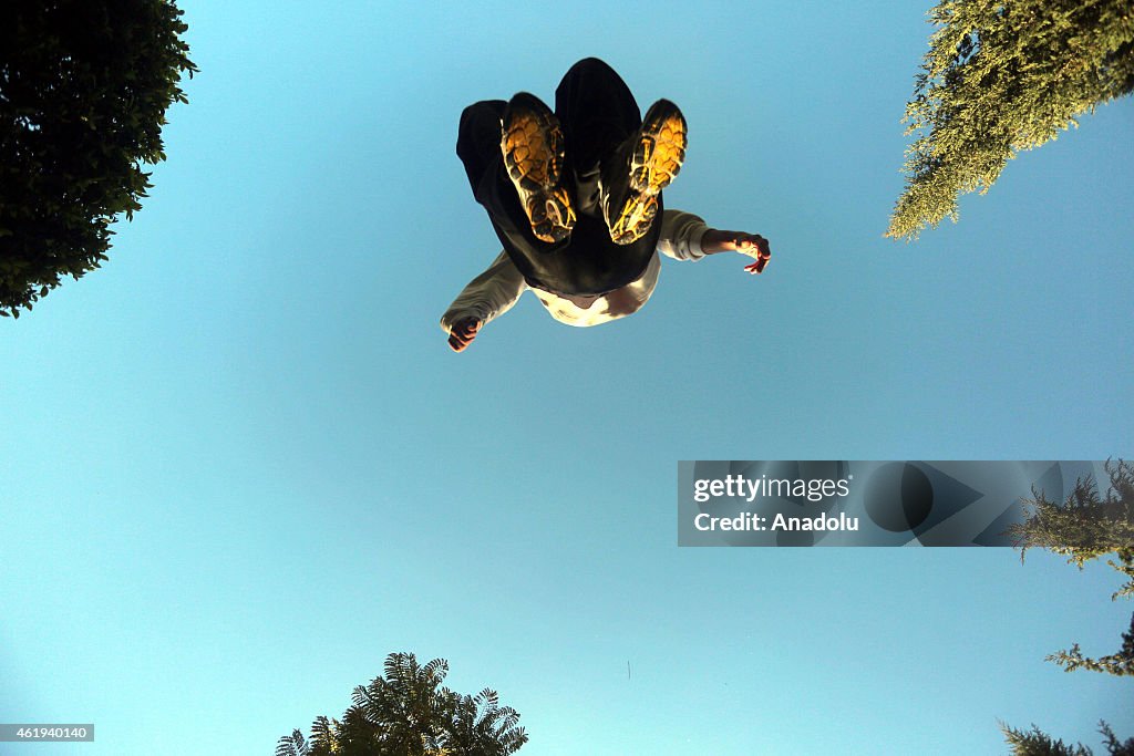 Palestinian youth practice their parkour skills