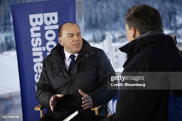 Axel Weber, chairman of UBS Group AG, left, speaks during a Bloomberg Television interview on day two of the World Economic Forum in Davos,...