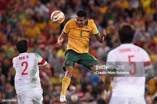 Tim Cahill of Australia heads the ball into the goal during the 2015 Asian Cup match between China PR and the Australian Socceroos at Suncorp Stadium...