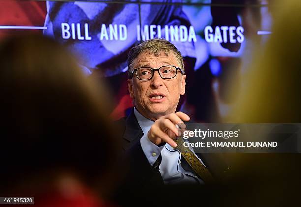 Bill Gates, founder of the Bill and Melinda Gates Foundation, gestures as he takes part in a discussion organised by British magazine The Economist...