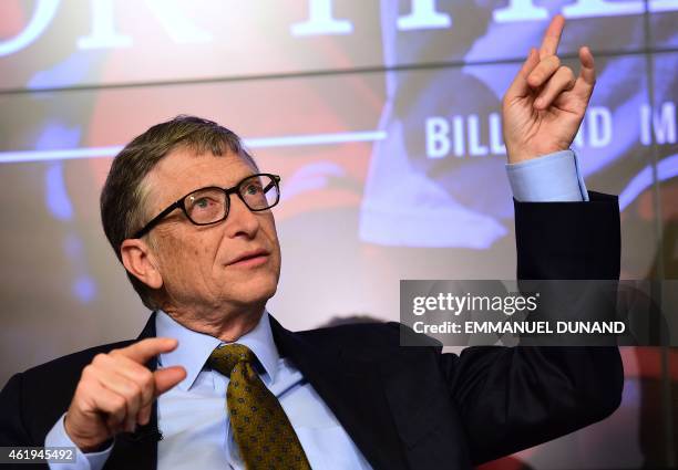 Bill Gates, founder of the Bill and Melinda Gates Foundation, gestures as he takes part in a discussion organised by British magazine The Economist...