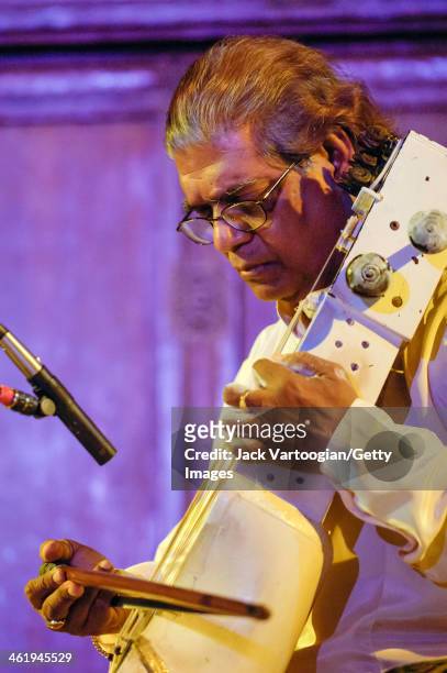 Indian musician Pandit Ramesh Misra plays sarangi during an early morning performance at the 6th Annual Chhandayan All Night Concert of Indian...