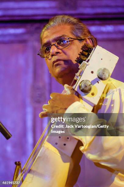 Indian musician Pandit Ramesh Misra plays sarangi during an early morning performance at the 6th Annual Chhandayan All Night Concert of Indian...