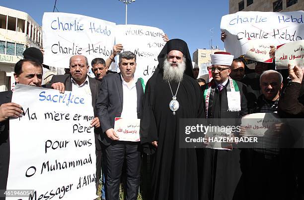 Palestinian Greek Orthodox Archbishop Atallah Hanna joins a demonstration along with a Muslim scholar and locals from Hebron on January 22, 2015 in...