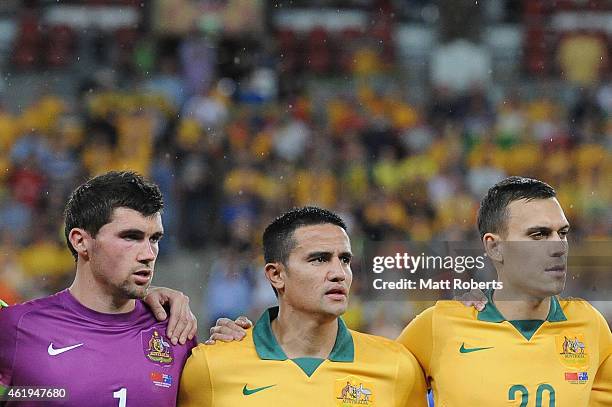 Mat Ryan, Tim Cahill and Trent Sainsbury of Australia sing the anthem during the 2015 Asian Cup match between China PR and the Australian Socceroos...