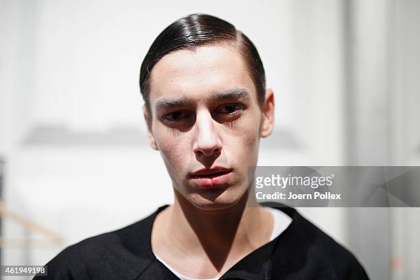 Model is seen getting styled backstage ahead of the Vektor show during the Mercedes-Benz Fashion Week Berlin Autumn/Winter 2015/16 at Brandenburg...