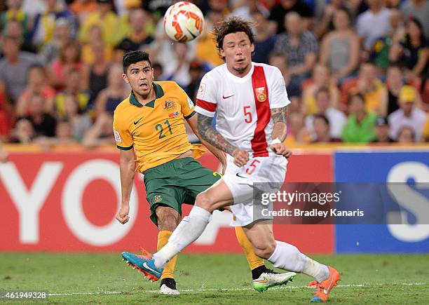 Massimo Luongo of Australia gets a kick past Zhang Linpeng of China during the 2015 Asian Cup match between China PR and the Australian Socceroos at...