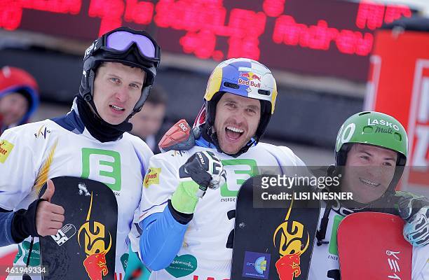 First placed Italy's Roland Fischnaller , second placed Russia's Andrey Sobolev and third placed Rok Marguc celebrate after the Men's Snowboard...