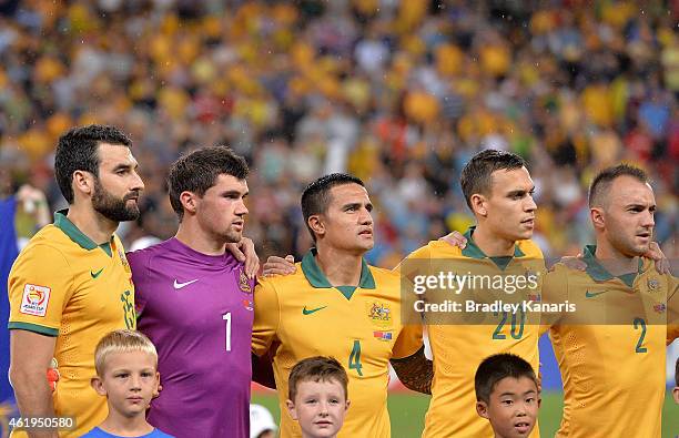 Australian players embrace for the national anthem before the 2015 Asian Cup match between China PR and the Australian Socceroos at Suncorp Stadium...