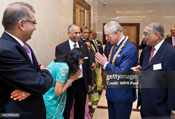 Prince Charles, Prince Of Wales meets guests during a tour of the Jain Temple on January 22, 2015 in Potters Bar, Hertfordshire, England. The Prince...