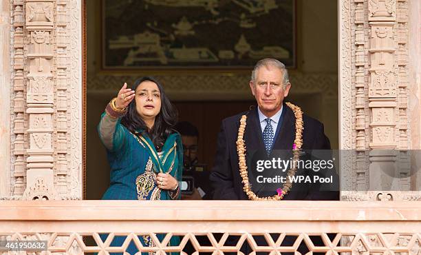 Prince Charles, Prince Of Wales looks out at the gardens with Arshana Sanghrajka an expert in Jain Temple Architecture during a tour of the Jain...