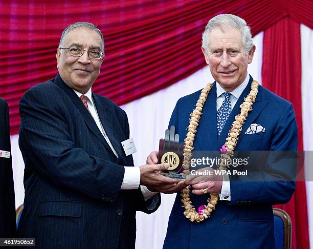 Prince Charles, Prince Of Wales is presented with the Ahimsa Award which recognises individuals who show compassion and tolerance to humanity,...